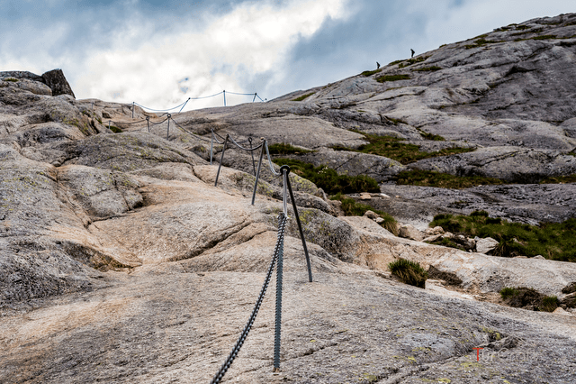 Chain-assisted rock section on the Kjerag hiking trail in Norway