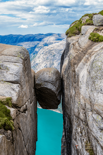 Open mountain plateau and marked hiking path near Kjerag above Lysefjord