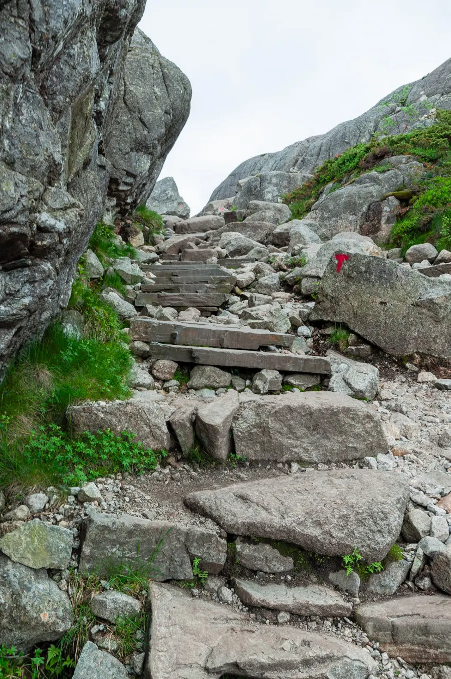 Stone steps and boulders on the rocky climb toward Preikestolen
