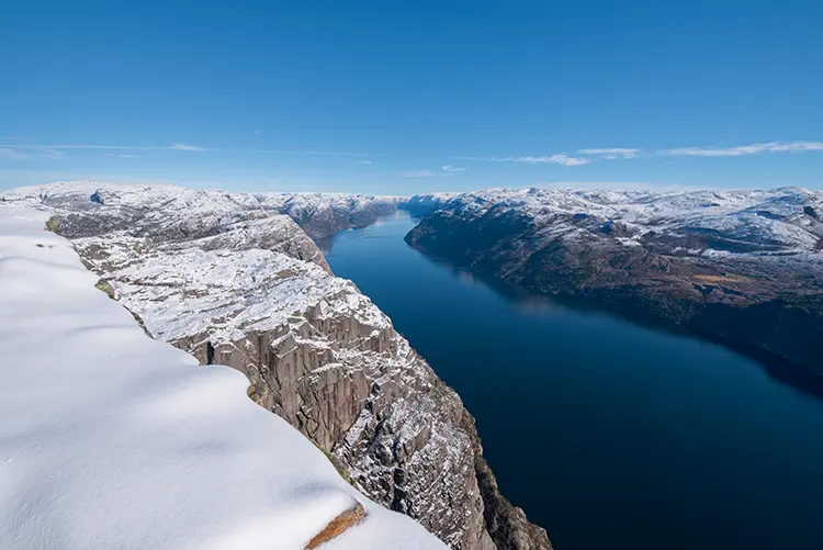 Preikestolen cliff and Lysefjord seen from above in snowy conditions