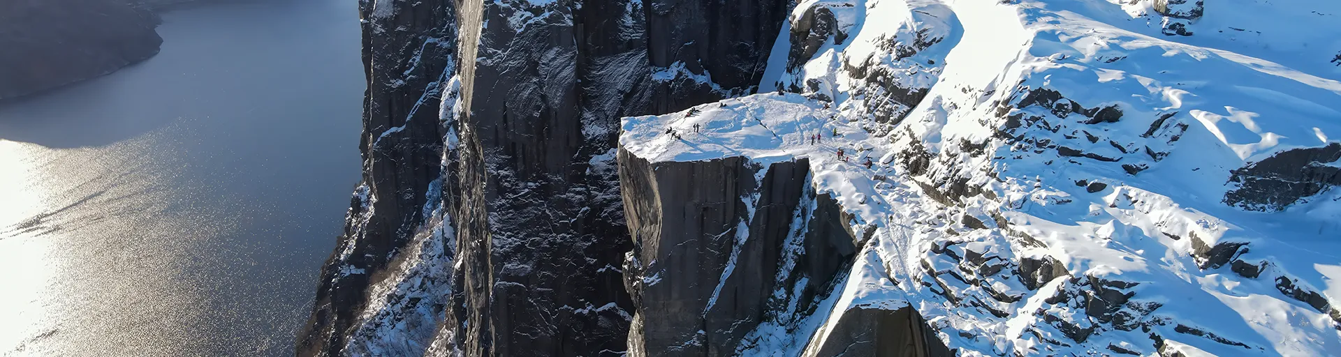Snow-covered Preikestolen cliff above Lysefjord