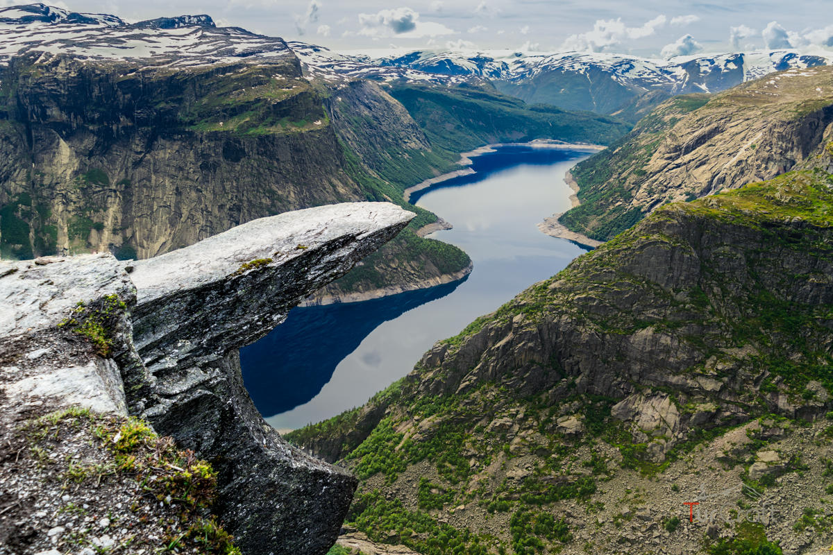 Trolltunga rock formation above the mountain lake in Norway